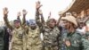 Nigerien military leaders wave to supporters at the General Seyni Kountche Stadium in Niamey, Niger, on Aug. 26, 2023. (Photo by AFP)
