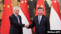 中国领导人习近平在北京会晤到访的新加坡总理李显龙。（2023年3月31日）