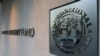 FILE - The International Monetary Fund logo is posted the headquarters building in Washington, Sept. 4, 2018. 
