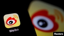 FILE - The logo of Chinese social media app Weibo is seen on a mobile phone, Dec. 7, 2021. 