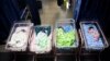 FILE - Newborn babies sleep in cots at a maternity center in Lagos, Nigeria, on Oct. 14, 2022. 