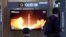 A TV screen shows a report of North Korea's rocket launch with a file image during a news program at the Seoul Railway Station in Seoul, South Korea, Aug. 24, 2023.