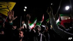 Iranian demonstrators chant slogans during an anti-Israeli gathering in front of the British Embassy in Tehran, Iran, April 14, 2024. 