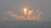 A Long March-5 rocket, carrying the Chang'e-6 mission lunar probe, lifts off as it rains at the Wenchang Space Launch Center in southern China, May 3, 2024. Pakistan's first lunar satellite was aboard the rocket.