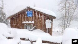 Snow continues to fall on the shores of Lake Tahoe in Tahoe City, Calif., on Saturday, March 2, 2024. (Jane Tyska/Bay Area News Group via AP)