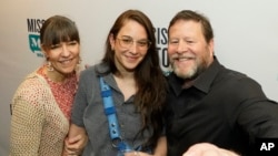Mississippi Today reporter Anna Wolfe and her parents, Bethel and Chris Wolfe, take a selfie after learning she'd won a Pulitzer Prize for her reporting on a $77 million welfare scandal, May 8, 2023, in Jackson, Miss.
