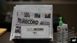 A printed issue of the Marion County Record sits on display at the newspaper's office, in Marion, Kan., Aug. 13, 2023.
