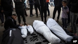 Members of the Abu Draz family mourn their relatives killed in the Israeli bombardment of the Gaza Strip, at a hospital morgue in Rafah, southern Gaza Strip, April 4, 2024.