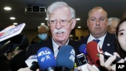 Former U.S. national security advisor John Bolton smiles to media members at the Global Taiwan National Affair Symposium XII in Taipei, Taiwan, April 29, 2023.