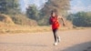 Taonere Banda runs on a track during training in Malawi in this undated photo. (Courtesy - Sightsavers)
