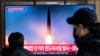 FILE - A TV screen shows a file image of a North Korean missile launch during a news program at the Seoul Railway Station in Seoul, South Korea, Dec. 18, 2023.