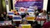 FILE - Afghan refugees hold an indoor rally in Islamabad, Pakistan, July 21, 2023, to demand their U.S. visas be processed. Many Afghans in Pakistan awaiting special immigration to the United States face deportation back to Afghanistan.