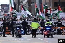 Demonstrators in support of Palestinians gather near where U.S. President Joe Biden speaks in Milwaukee, Wisconsin, March 13, 2024.