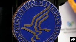 FILE - The seal for the US Department of Health and Human Services is displayed in Media, Pa., Sept. 15, 2017.