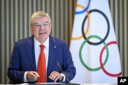 FILE - IOC President Thomas Bach speaks at the opening of the executive board meeting of the IOC, at the Olympic House, in Lausanne, Switzerland, June 20, 2023.(Laurent Gillieron/Keystone via AP)