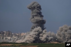 Smoke rises following an Israeli airstrike in the Gaza Strip, as seen from southern Israel, Oct. 20, 2023.