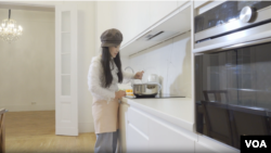 Years of harassment means Su Yutong is hesitant to eat at Berlin's Chinese restaurants. So she learned to cook her favorite dishes from home. (Jonathan Spier/VOA)