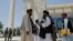 FILE - Taliban members are seen at Kabul University in Kabul, Afghanistan, June 14, 2023.