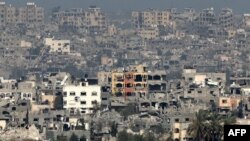 Fotografija napravljena sa pozicije u južnom Izraelu pokazuje unipštene zgrade u Pojasu Gaze, 6. marta 2024. (Foto: AFP/Jack Guez)