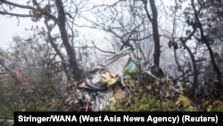 A view of the wreckage of Iranian president Ebrahim Raisi's helicopter at the crash site on a mountain in Varzaghan area, northwestern Iran, May 20, 2024.