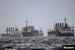 FILE - Vessels await inspection under the Black Sea Grain Initiative, brokered by the United Nations and Turkey, in the southern anchorage of the Bosphorus in Istanbul, Turkey, Dec. 11, 2022.