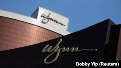 FILE - Company logos are displayed at Wynn Macau resort in Macau, China, Feb. 8, 2018. 