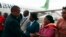 Malawi Vice President Saulos Chilima, left, greets government officials upon his return from South Korea in Lillongwe, June 9, 2024.