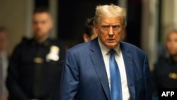 FILE - Former President and Republican presidential candidate Donald Trump arrives for his hush money trial at Manhattan Criminal Court in New York City, May 20, 2024. 