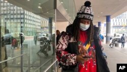 Frank Cope waits for a car after a checkup at Bellevue Hospital in New York on Jan. 3, 2024. 