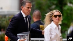 Hunter Biden, left, arrives to federal court with his wife, Melissa Cohen Biden, in Wilmington, Delaware, June 6, 2024.