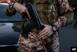 A member of Iran's Islamic Revolutionary Guard Corps is present at an anti-Israeli gathering at the Felestin (Palestine) Square in Tehran, April 15, 2024.