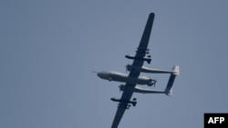 FILE - A Sichuan Tengden's TB-001, nicknamed "Twin-Tailed Scorpion" flies at the 13th China International Aviation and Aerospace Exhibition in Zhuhai in southern China's Guangdong province on Sept. 28, 2021. 