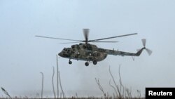 FILE — A Russian Mi-8 military helicopter being tested by the Russian Air Force of the Southern Military District in the Rostov region, Russia, Jan. 19, 2022. Ukraine's GUR military intelligence say it lured a Russian military pilot to land his Mi-8 at a Ukrainian airfield.