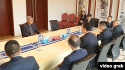 Interior Minister Mohsin Naqvi meets with Chinese investigators and diplomats at Beijing’s embassy in Islamabad, March 29, 2024, in this Pakistan state TV screen grab.