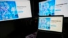 FILE - Screens display the sign-in page of the social media platform X — formerly known as Twitter — July 24, 2023, in Belgrade, Serbia. Rights advocates are urging social media platforms to do more to prevent Chinese authorities from obtaining the personal information of users. 