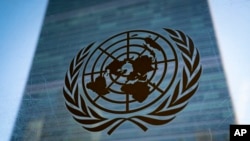 FILE - The symbol of the United Nations is displayed outside the Secretariat Building, Feb. 28, 2022, at UN headquarters.