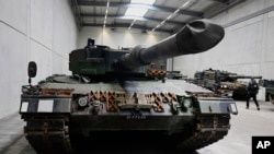 FILE - German-made Leopard 2 tanks are seen at a production facility in Unterluess, Germany, Feb. 12, 2024.