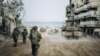 This handout picture released by the Israeli army on Jan. 1, 2024 shows Israeli soldiers operating in the Gaza Strip amid continuing battles between Israel and the Palestinian militant group Hamas. (Photo by Israeli Army / AFP) 