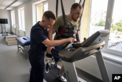 Mykhailo Yurchuk, a former Ukrainian paratrooper of the 95th brigade, learns to run on his prosthetic leg at the Unbroken rehabilitation center in Lviv, Ukraine, Aug. 23, 2023.