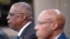 FILE - U.S. Secretary of Defense Lloyd Austin, left, and Chairman of the Joint Chiefs of Staff Air Force Gen. Charles Brown, participate in a virtual Ukraine Defense Contact Group meeting at the Pentagon, outside Washington, Nov. 22, 2023.
