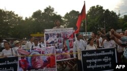 FILE - Myanmar activists protest against Wanbao Mining at China's embassy in Yangon, Nov. 29, 2013. Longtime tensions involving the company were inflamed Aug. 14, 2023, when Burmese troops protecting a Wanbao mine in Sarlingyi Township fired on civilians.