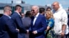 President Joe Biden, center, and first lady Jill Biden, second right, arrive on Air Force One at Harrisburg International Airport to attend a campaign rally in Harrisburg, Pennsylvania, July 7, 2024.