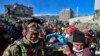 Turkish rescue workers from Kazakhstan and Turkey pull out Hatice Akar from a collapsed building 180 hours after the earthquake in Kahramanmaras, southern Turkey, early Monday, Feb. 13, 2023.