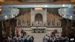 Chaldean Christians attend a service in the Mar Youssef Cathedral in Irbil, Iraq, on July 30, 2023.