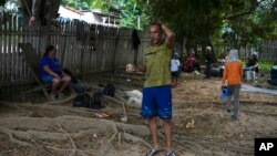 Venezuelan migrant Samuel Rodriguez stands on the grounds of the shelter in Assis, Brazil, June 20, 2024. 