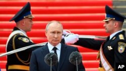 FILE - Russian President Vladimir Putin addresses members of the Defense Ministry, the National Guard, the Interior Ministry, the Federal Security Service and the Federal Guard Service at the Kremlin, in Moscow on June 27, 2023. 