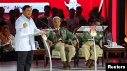 Indonesia's Defense Minister and presidential candidate, Prabowo Subianto speaks during a televised debate at the Istora Senayan stadium in Jakarta, Jan. 7, 2024.