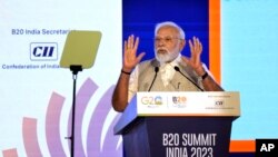 Indian Prime Minister Narendra Modi speaks at a special session of the Business 20 or B20 Summit ahead of the G20 Summit to be held in September, in New Delhi, India, Aug. 27, 2023. 
