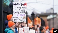 Junior doctors and members of the British Medical Association (BMA) demonstrate outside Royal Victoria Infirmary, Newcastle, England, Jan. 3, 2024, as they take to picket lines for six days.