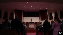 Rabbi Daniel Fellman, left, and Cantor David Reinwald, right, lead Shabbat service, Oct. 13, 2023, at Temple Sinai in Pittsburgh, Pennsylvania.